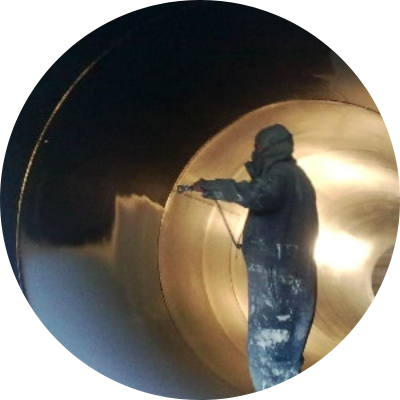 industrial painter coating the interior of a cylinder