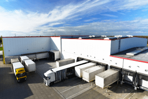 the exterior of a manufacturing plant in Columbus Ohio, painted white with a red stripe