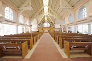 a church vaulted ceiling painted in a soft cream