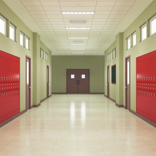 a school hallway painted green with red lockers